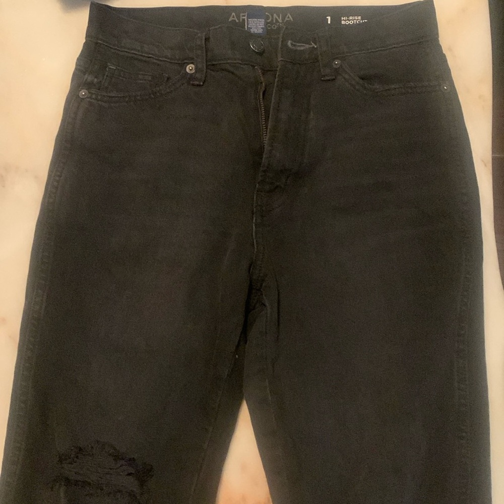 I am selling these cute distressed boot cut black jeans!